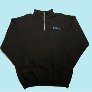 Black long sleeve branded short collar pull over sweater w/ thick grey zipper.